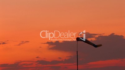 HD windsock moving from wind at sunset