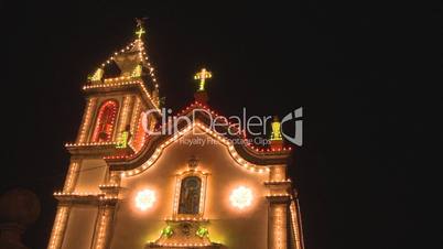Church decorated with Christmas lamps