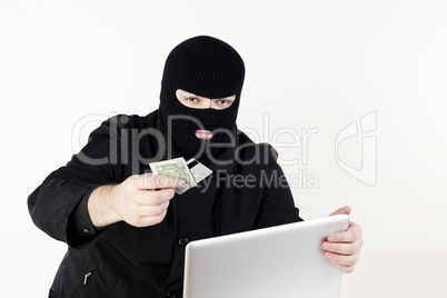 Man stealing data from a laptop