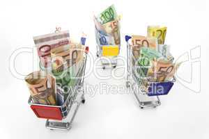 Three Shopping carts with money