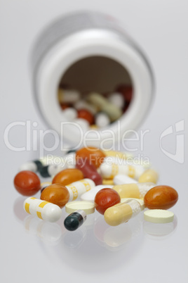 Different pills on white