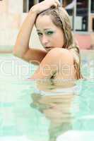 young alluring blonde in a pool