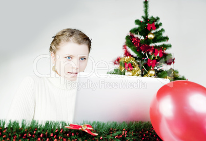 Young lady Christmas shopping online
