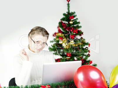 Young lady Christmas shopping online