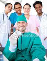 Smiling surgeon with his team