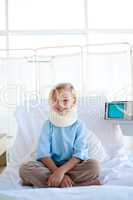 girl sitting on a hospital bed