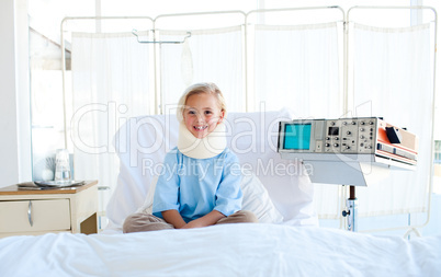 girl sitting on a hospital bed