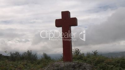 Time lapse cross in fog on mountain