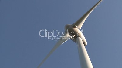 Wind power turbine detail on blue sky