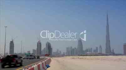 highway traffic at dubai skyline burj