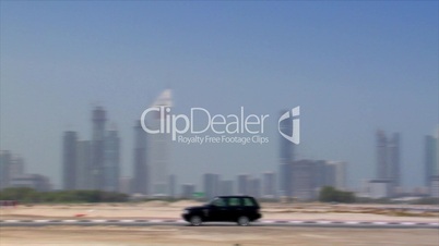 black jeep crossing dubai skyline