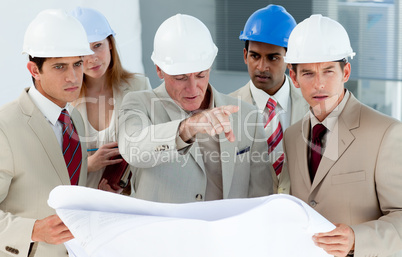 engineers studying plans