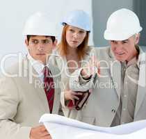 Engineers studying blueprints