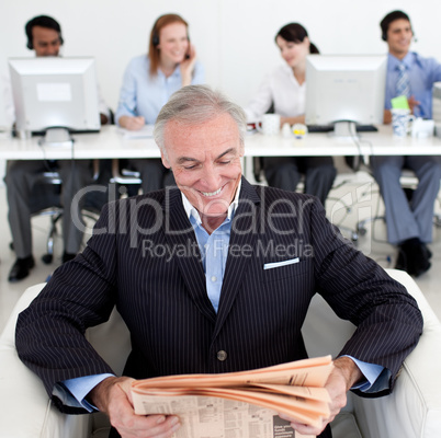 businessman reading a newspaper