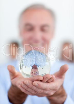 businessman holding a crystal ball