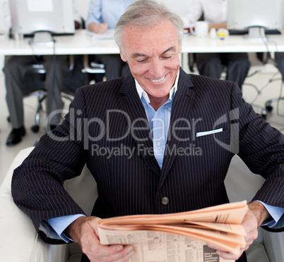 businessman reading a newspaper