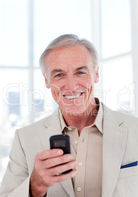 Senior businessman with mobile phone