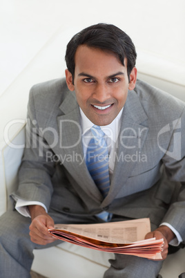 Businessman reading a newspaper