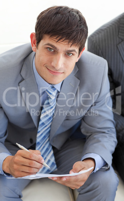 Smiling businessman in a waiting room