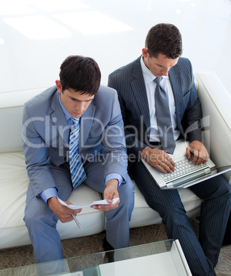 Two businessmen in a waiting room
