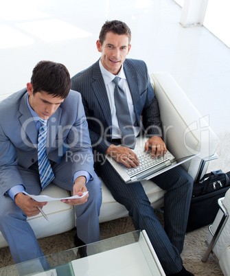 Businessmen in a waiting room