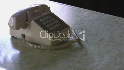 Picking up receiver on an old push button phone