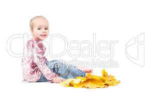 Toddler with maple leaves