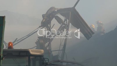 Firefighters fighting fire in warehouse