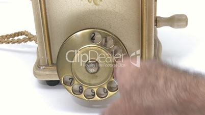 Making a phone call on vintage telephone