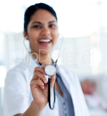 Smiling doctor holding a stethoscope