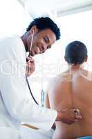 doctor checking patient