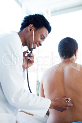 Young doctor examining a patient