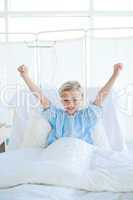 Happy child patient punching the air