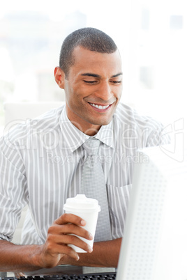 businessman holding a drinking cup