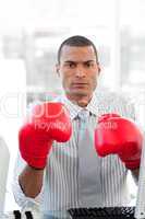 businessman wearing boxing gloves