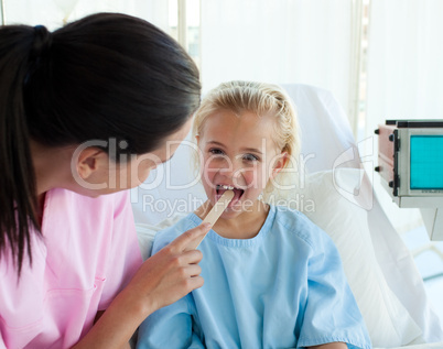 doctor examining patient's throat