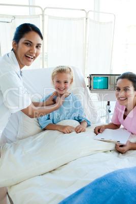 Doctor and nurse examining a patient