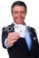 businessman holding all the aces