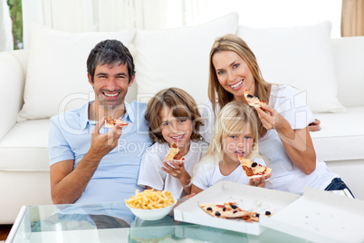 family eating a pizza