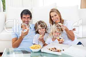 family eating a pizza