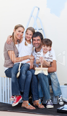 happy family decorating a room