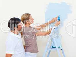 Happy couple painting together