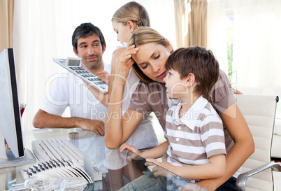 smiling family at a computer
