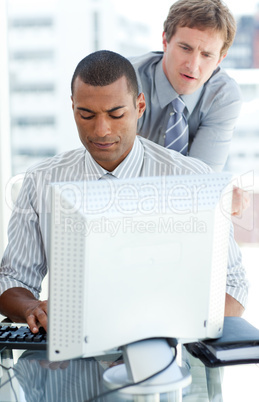 businessmen at a computer