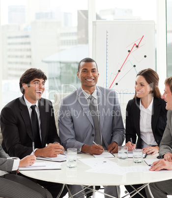 manager in a meeting with his team