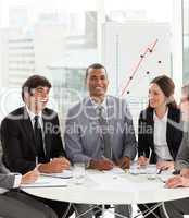 manager in a meeting with his team