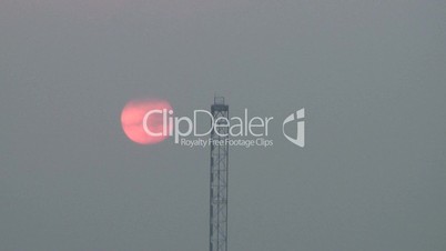Crane cloudy sun
