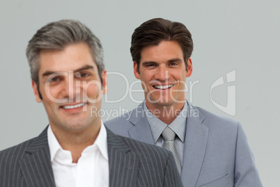 Two businessman standing in a line
