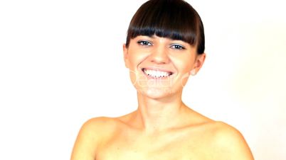 Young attractive woman smiling and flirting with camera