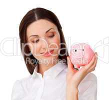 businesswoman looking at a piggybank